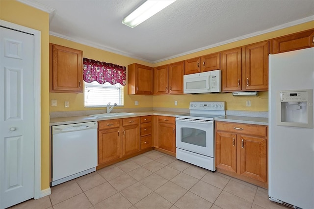 kitchen featuring sink, crown molding, white appliances, and light tile floors