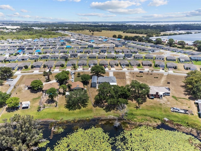 bird's eye view with a water view and a residential view