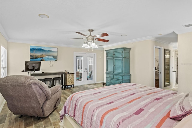 bedroom featuring access to outside, visible vents, wood finished floors, and french doors