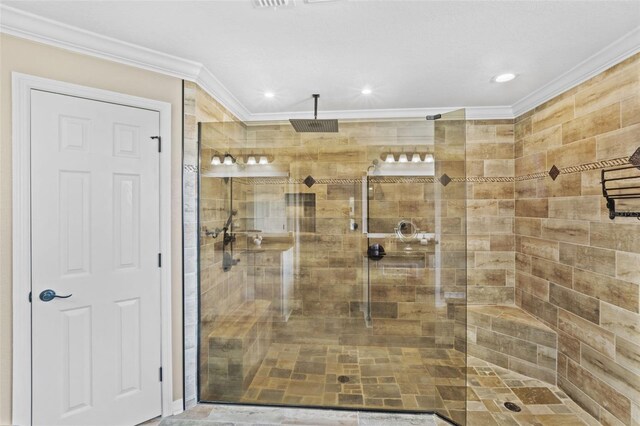 bathroom featuring recessed lighting, a tile shower, and crown molding