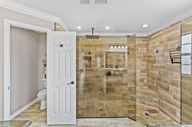 full bath with toilet, baseboards, ornamental molding, and walk in shower