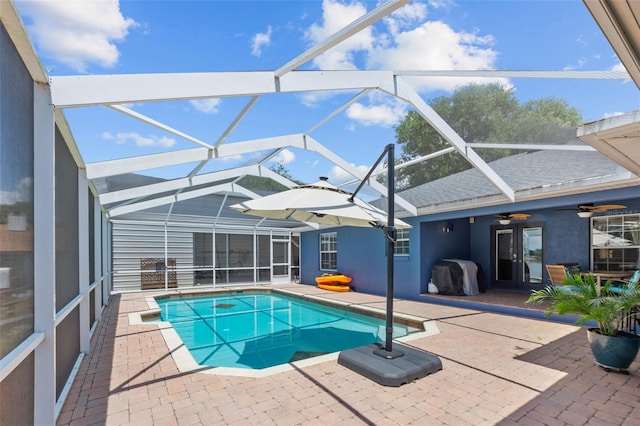 outdoor pool featuring a lanai, grilling area, a ceiling fan, and a patio