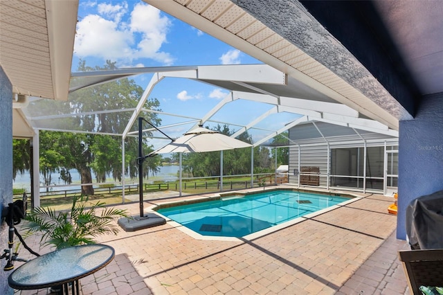 pool featuring a lanai and a patio