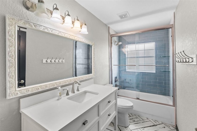 bathroom featuring toilet, a textured wall, visible vents, and vanity