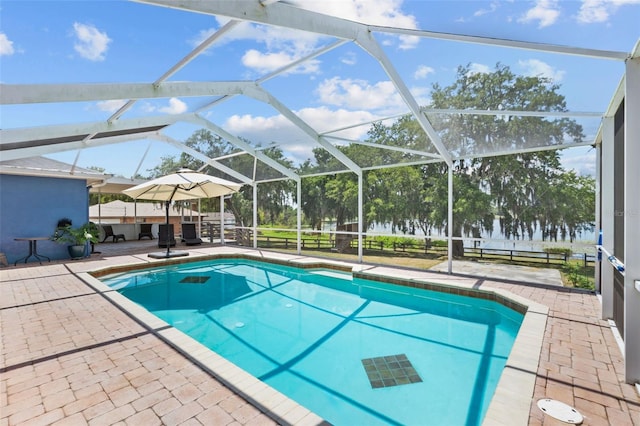 pool with a patio area and a lanai