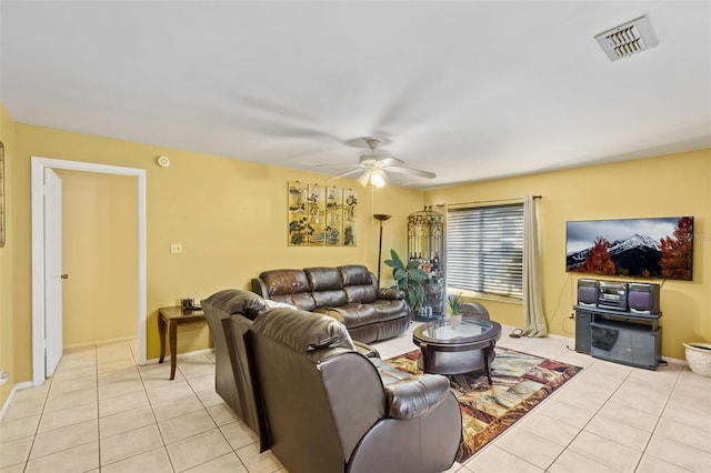 tiled living room with ceiling fan