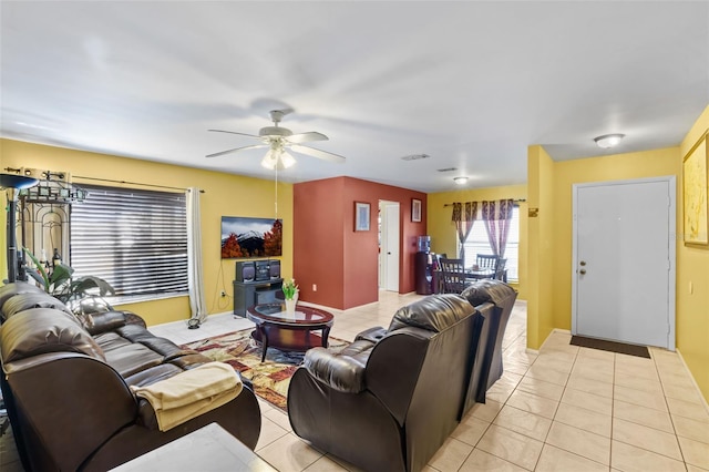 living room with ceiling fan and light tile floors