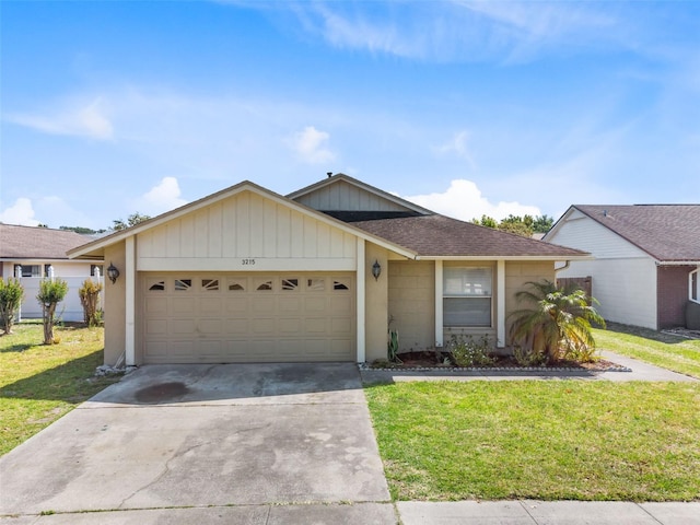 ranch-style home featuring a garage and a front yard