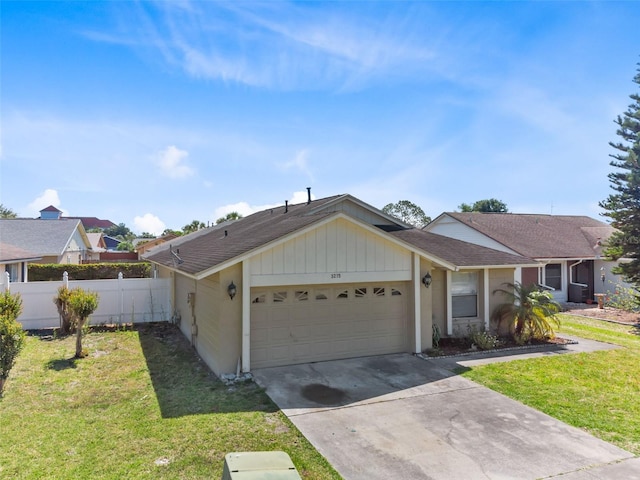 ranch-style house featuring a front lawn and a garage