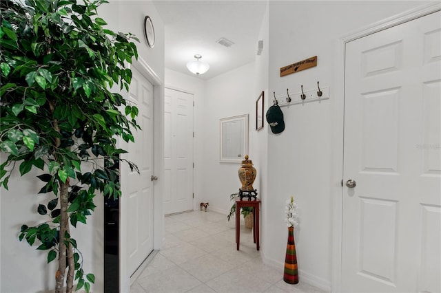 foyer featuring light tile flooring