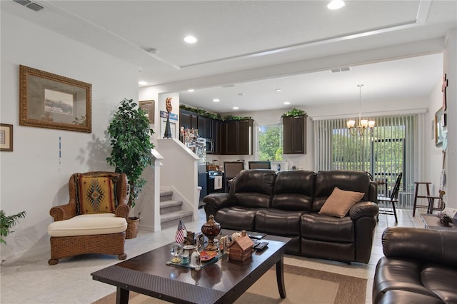 living room featuring an inviting chandelier and light tile floors