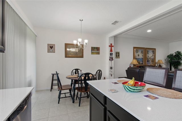 interior space with stainless steel dishwasher, an inviting chandelier, pendant lighting, and light tile floors