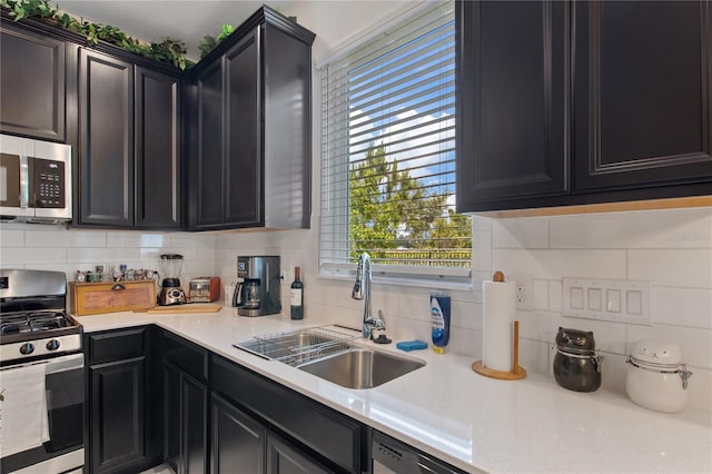 kitchen featuring sink, backsplash, and appliances with stainless steel finishes