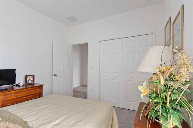 carpeted bedroom with a closet