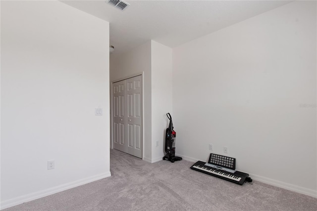 spare room with light colored carpet