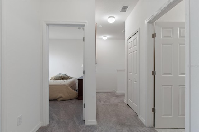 corridor with carpet floors