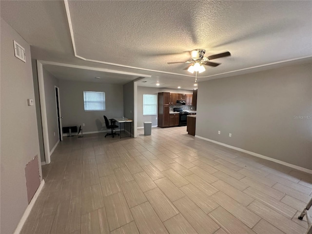 unfurnished living room featuring a textured ceiling, ceiling fan, and light hardwood / wood-style flooring