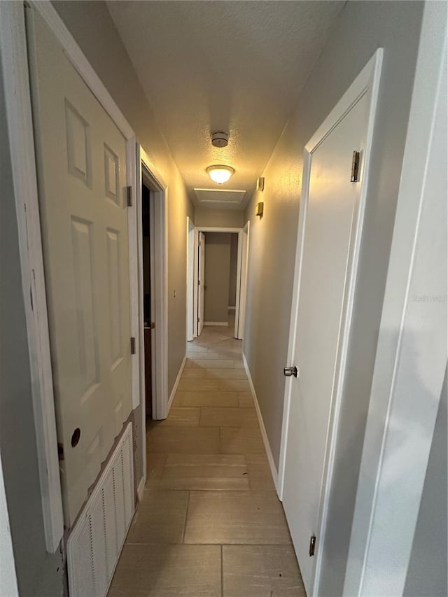 corridor featuring light hardwood / wood-style floors