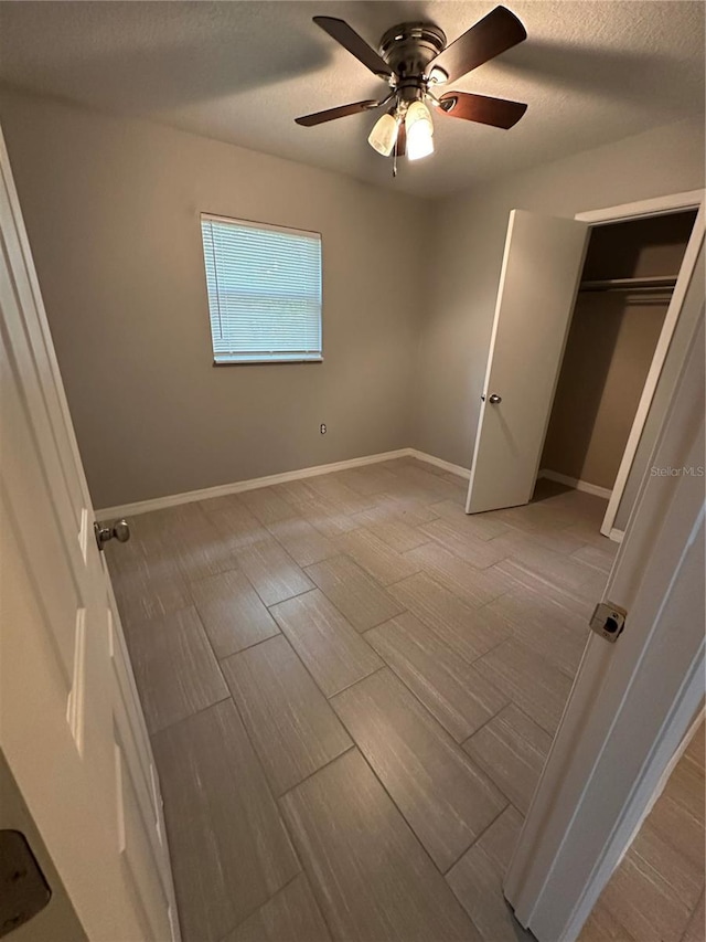 unfurnished bedroom with a closet and ceiling fan