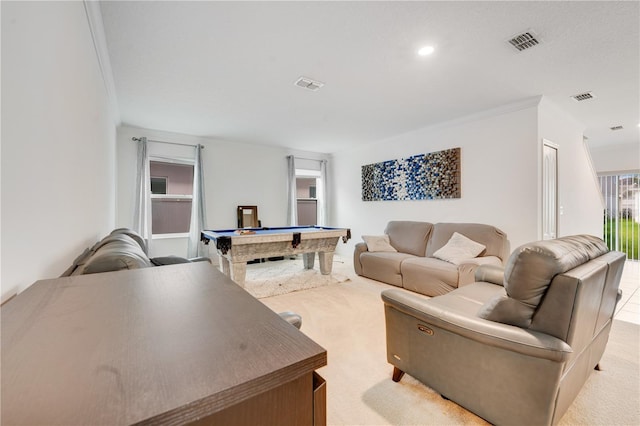 carpeted living room featuring crown molding and pool table