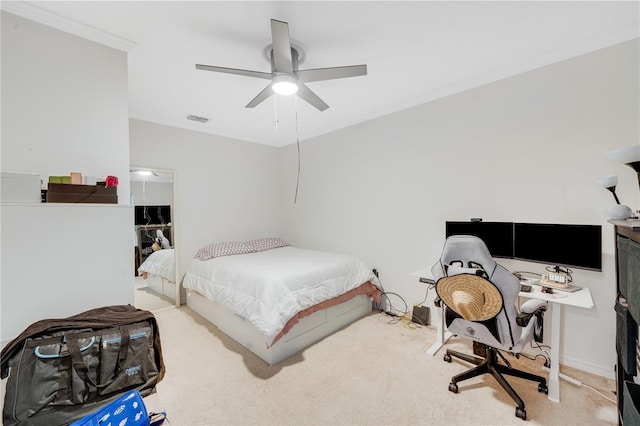 bedroom featuring carpet flooring, ceiling fan, and crown molding