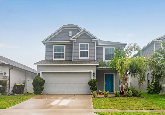 view of front of property featuring cooling unit, a garage, and a front lawn