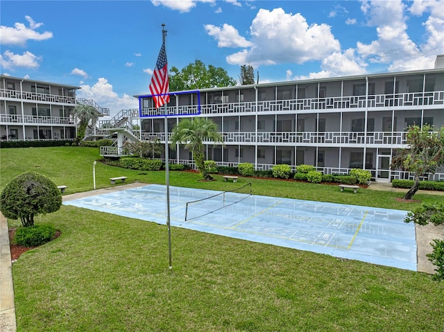 view of home's community with a lawn