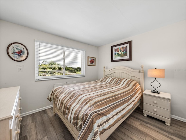 bedroom featuring dark hardwood / wood-style flooring