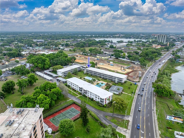 birds eye view of property with a water view