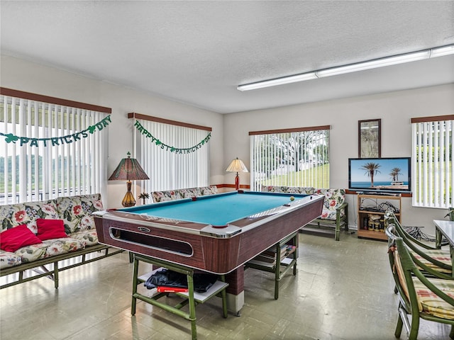 playroom featuring billiards and a textured ceiling