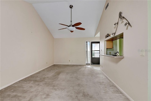 unfurnished living room featuring carpet, ceiling fan, and high vaulted ceiling