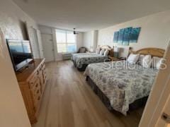 bedroom with wood-type flooring