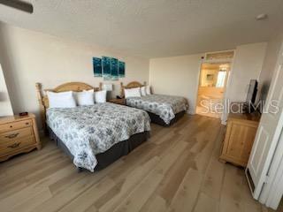 bedroom with wood-type flooring