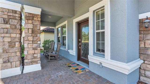 property entrance with covered porch