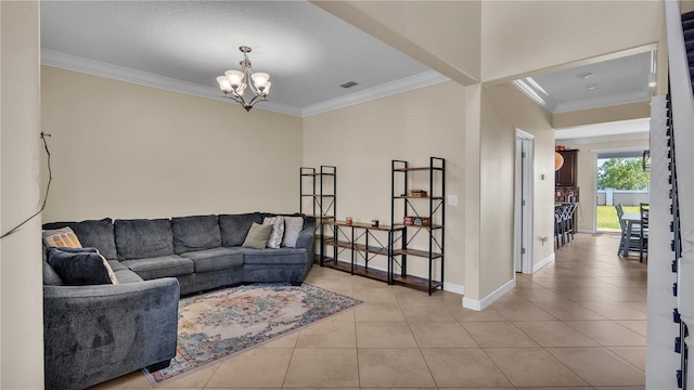 living room with crown molding, a chandelier, and light tile patterned floors