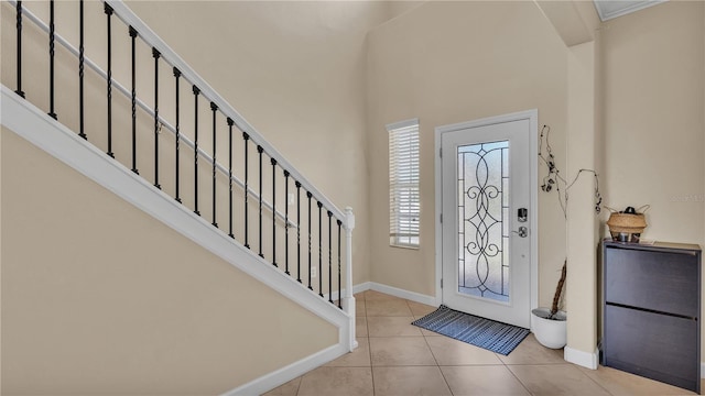 foyer entrance with light tile patterned flooring