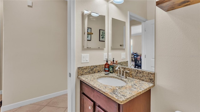 bathroom with tile patterned flooring and vanity