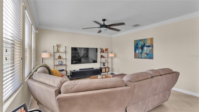 living room featuring ceiling fan, light tile patterned floors, and ornamental molding