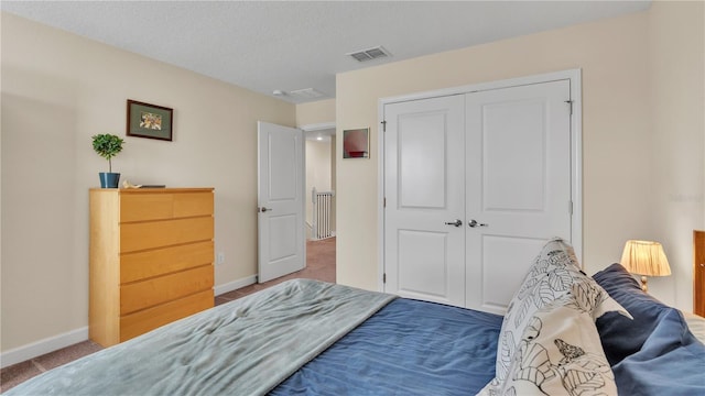 bedroom with carpet floors and a closet