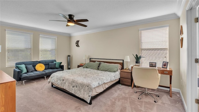 bedroom featuring light colored carpet, ornamental molding, a textured ceiling, and ceiling fan