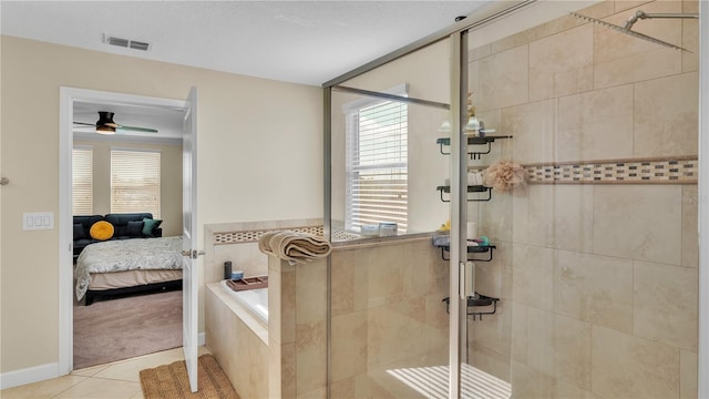 bathroom featuring ceiling fan, shower with separate bathtub, and tile patterned floors