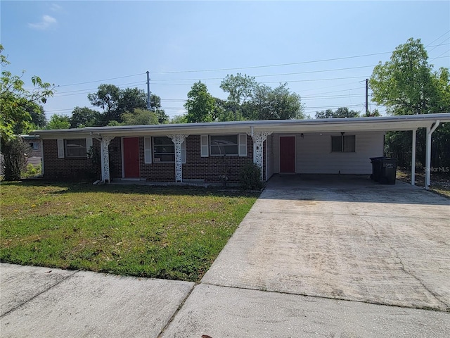 single story home with a front lawn and a carport