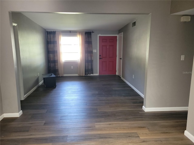 spare room with dark hardwood / wood-style flooring