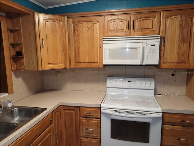 kitchen featuring sink, tasteful backsplash, white appliances, and ornamental molding