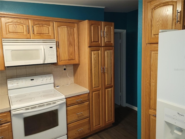 kitchen with white appliances, tasteful backsplash, and dark wood-type flooring