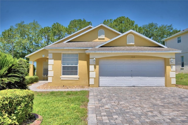 view of front of property with a garage