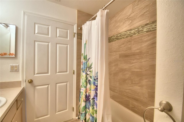 bathroom featuring vanity and shower / tub combo