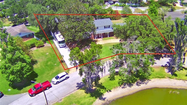 birds eye view of property with a water view