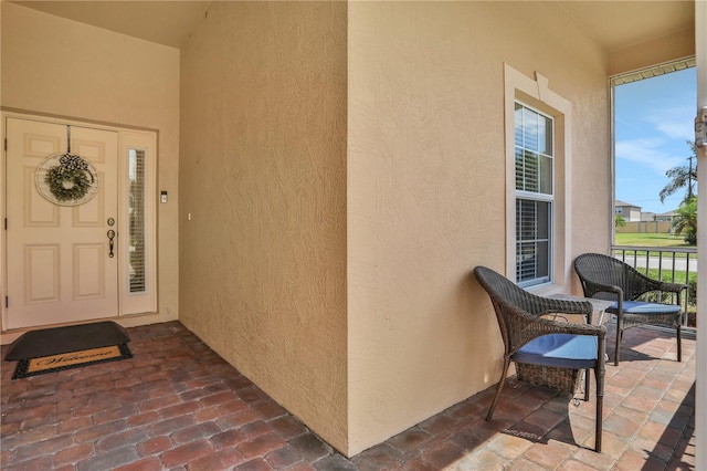 property entrance featuring a porch