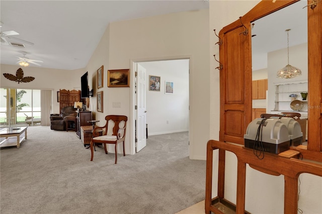 corridor with carpet flooring and lofted ceiling